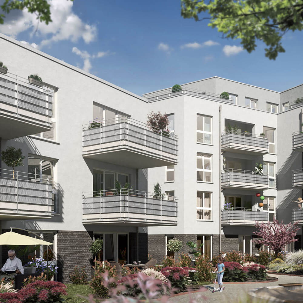 Außenansicht Mehrfamilienhaus mit Balkonen und Innenhof